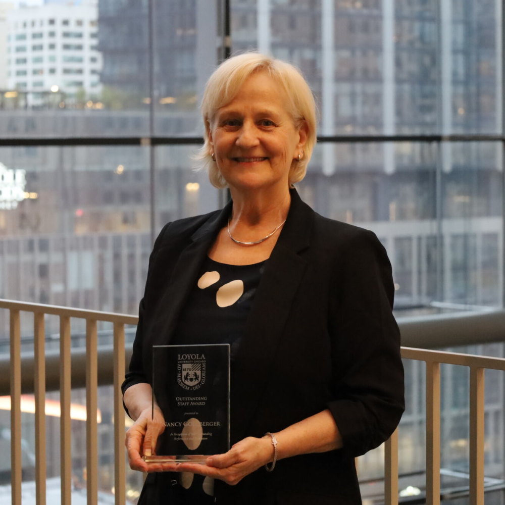 Assistant Dean Nancy Goldberger receiving the 2024 SOE Excellence Award.